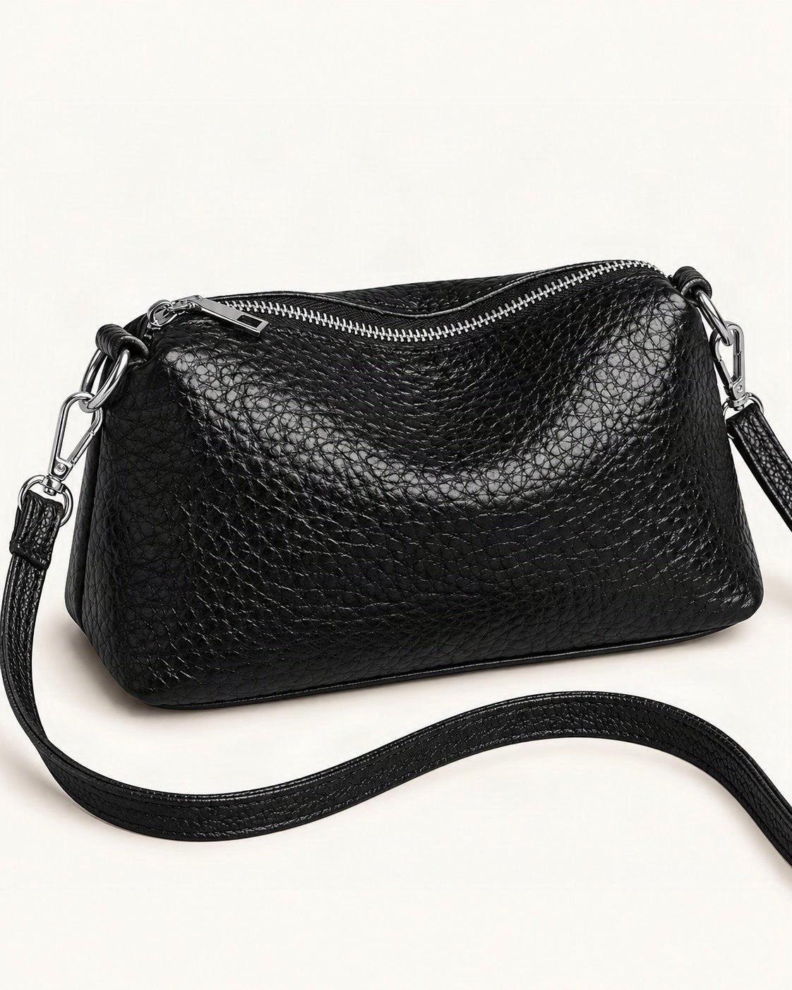 Top-Grain Cowhide Small Shoulder Crossbody Bag — front three-quarter view on a warm white background