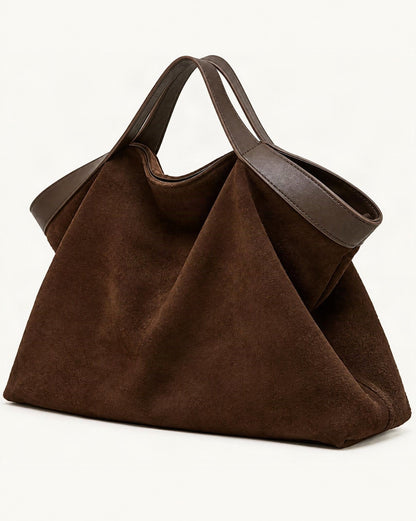 Cowhide Nubuck Leather Crossbody Tote Bag — front three-quarter view on a warm white background