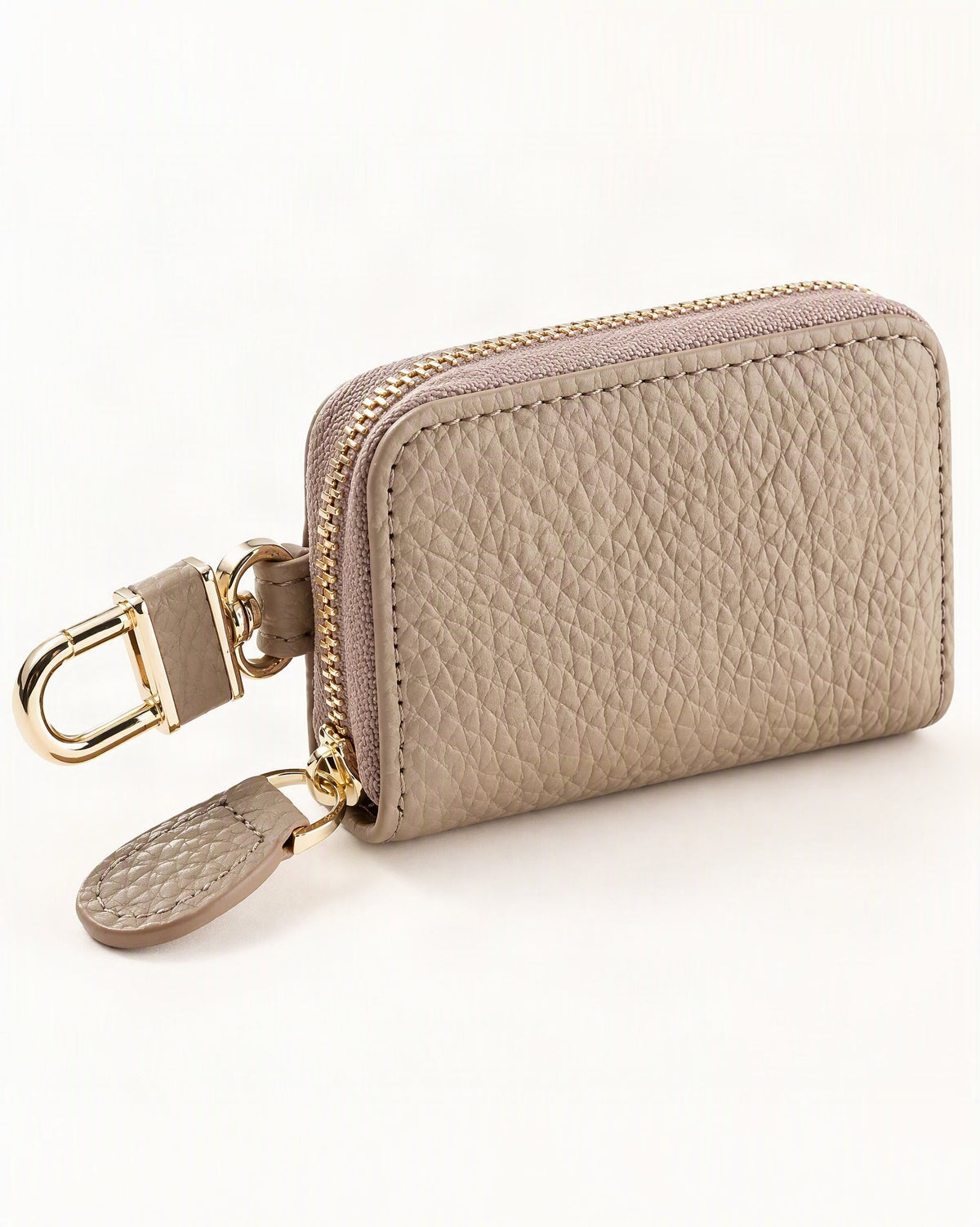 Genuine Leather Zip-Around Key Pouch with Carabiner Clip — front three-quarter view on a warm white background