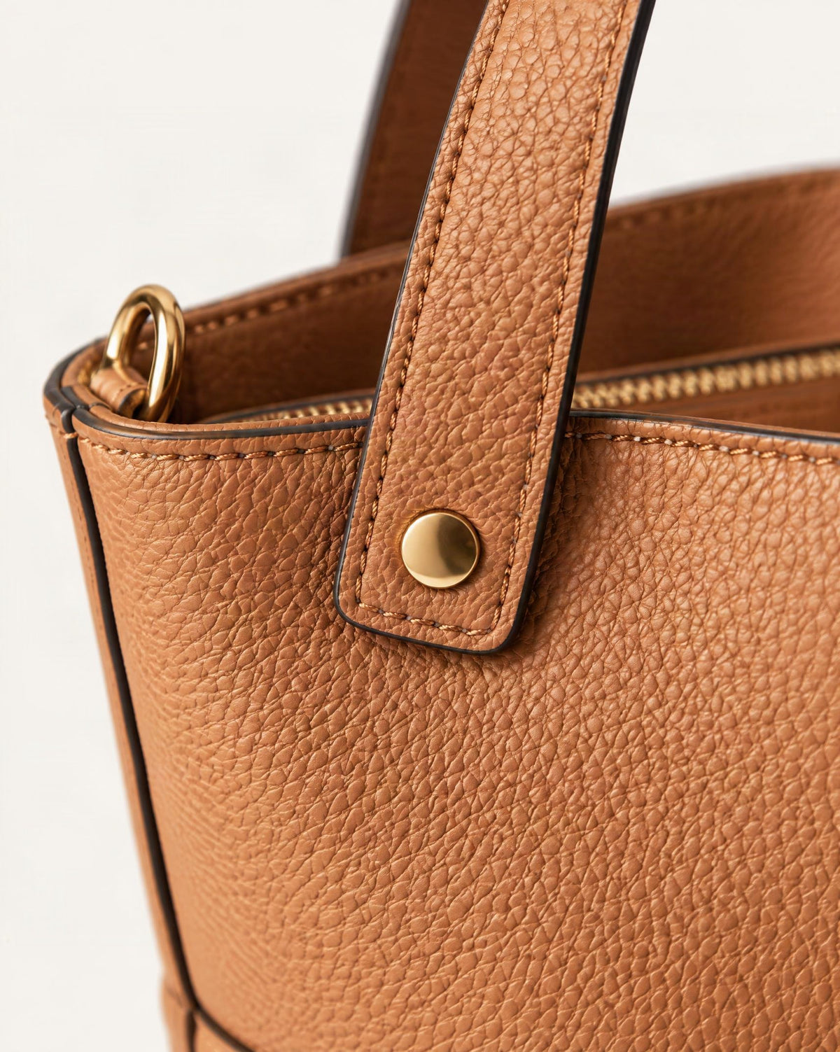 Top-Grain Cowhide Bucket Bag with Detachable Crossbody Strap hardware and pebbled cowhide detail, close up