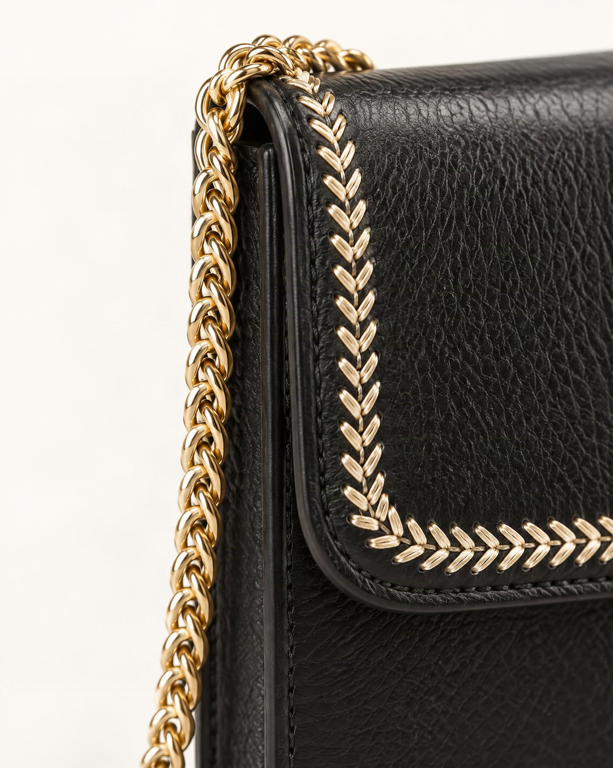 Top-Grain Cowhide Micro Crossbody Phone Bag with Chain Strap hardware and cowhide detail, close up