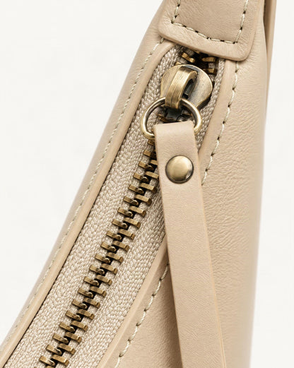 Cowhide Crescent Shoulder Bag hardware and cowhide detail, close up