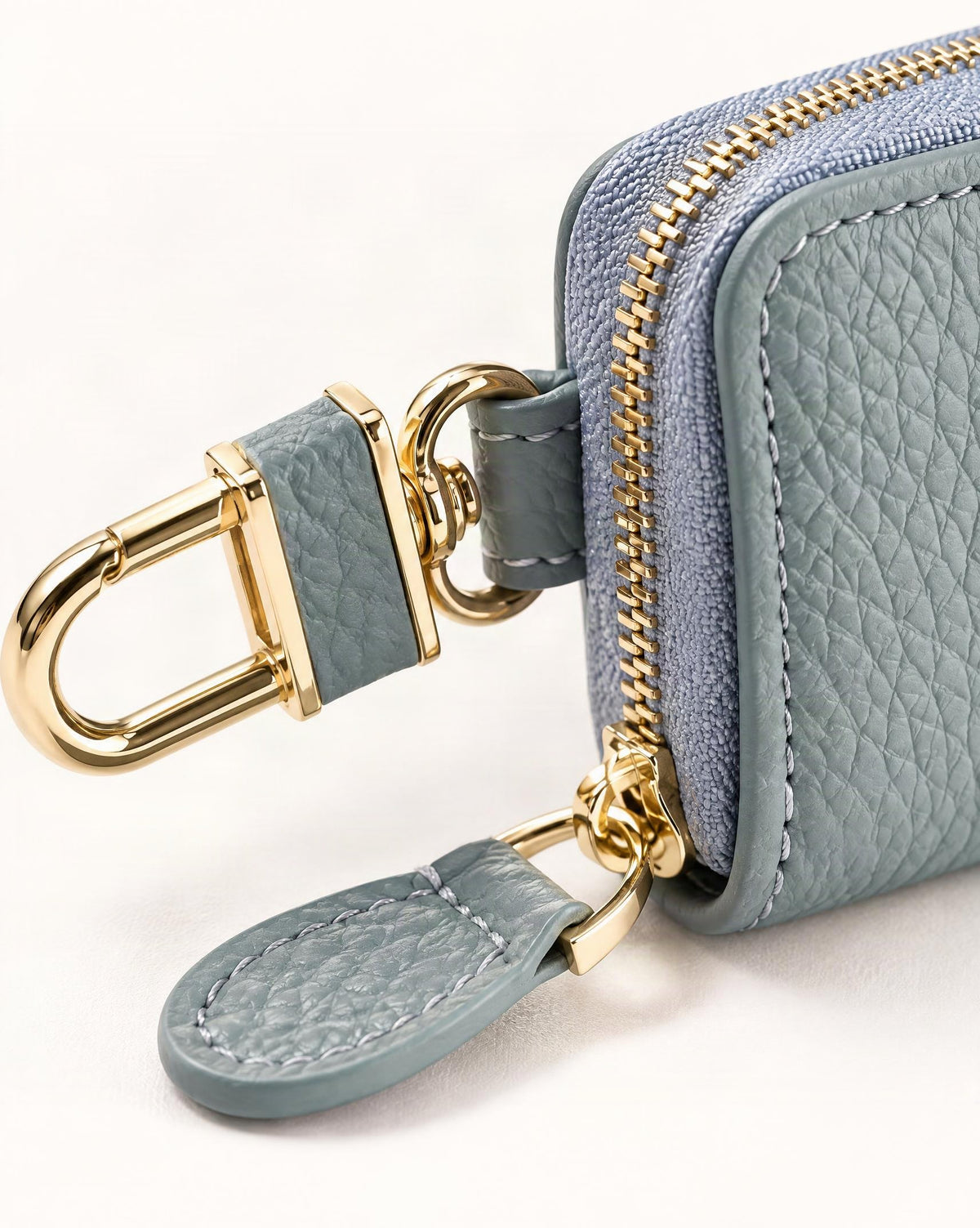 Genuine Leather Zip-Around Key Pouch with Carabiner Clip hardware and cowhide detail, close up