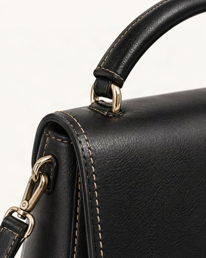 Cowhide Leather Small Boston Crossbody Bag with Top Handle hardware and cowhide detail, close up