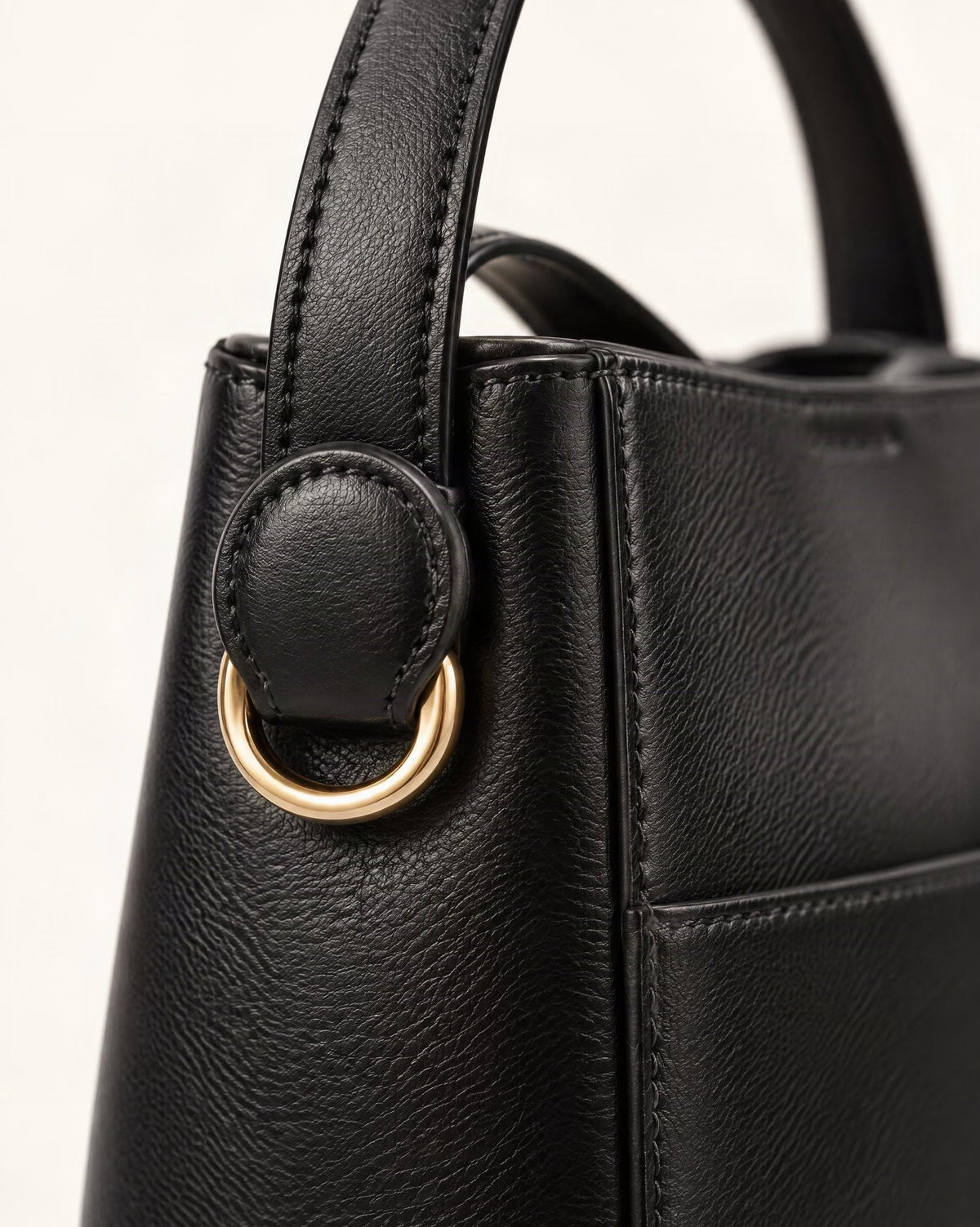 Cowhide Leather Bucket Crossbody Bag hardware and cowhide detail, close up