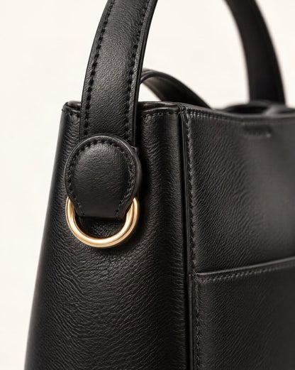Cowhide Leather Bucket Crossbody Bag hardware and cowhide detail, close up