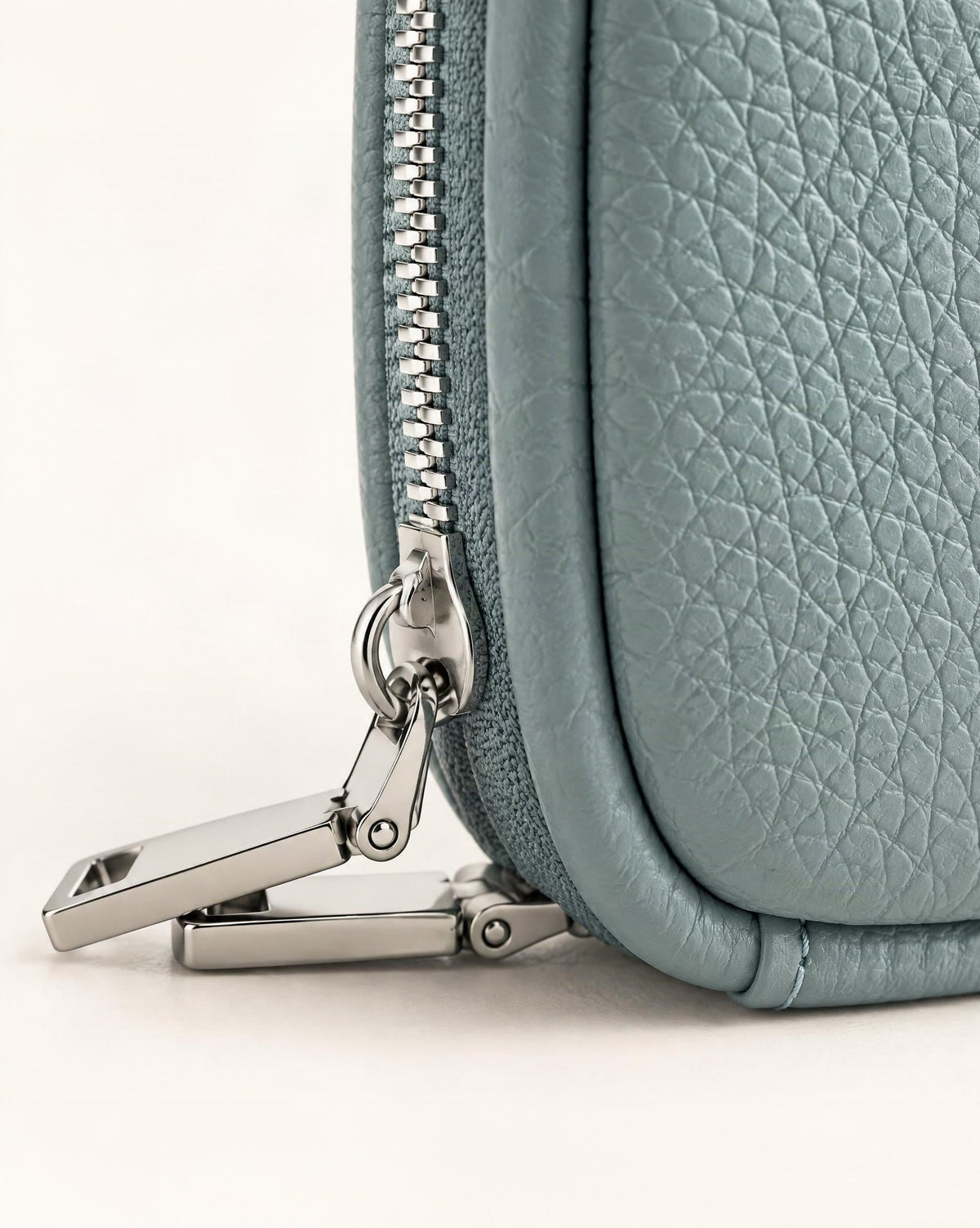 Pebbled Leather Mini Cosmetic Pouch hardware and pebbled cowhide detail, close up