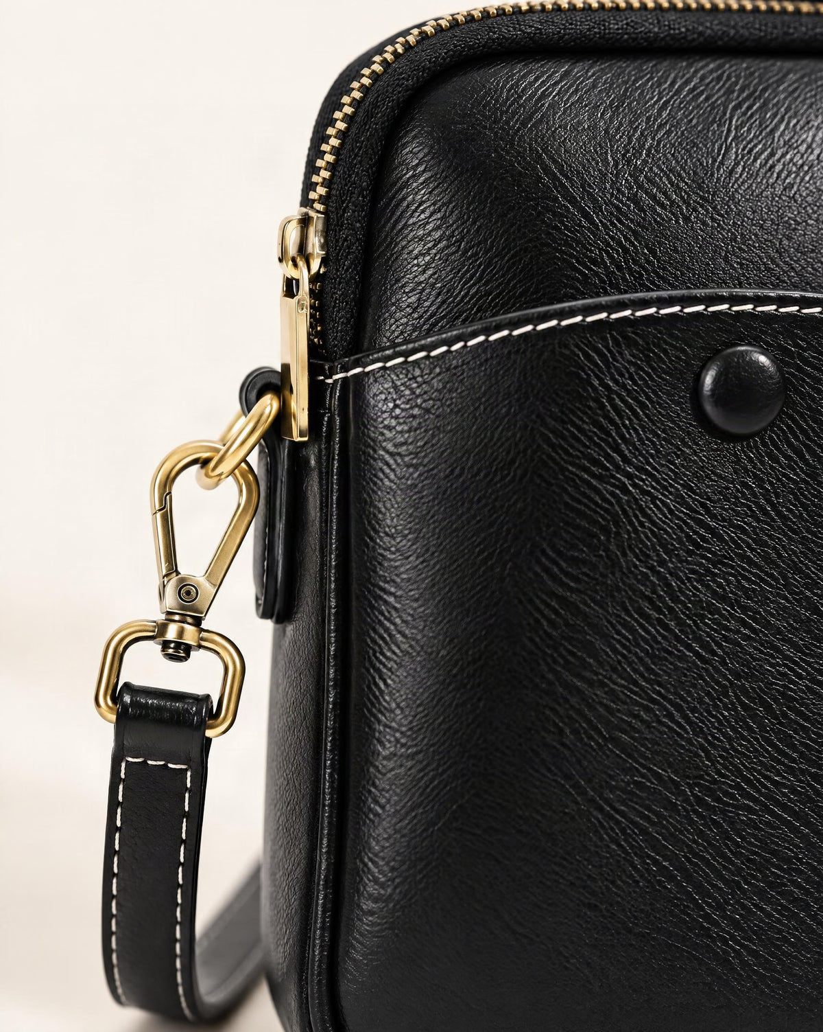 Cowhide Leather Micro Crossbody Bag with Adjustable Strap hardware and smooth cowhide detail, close up