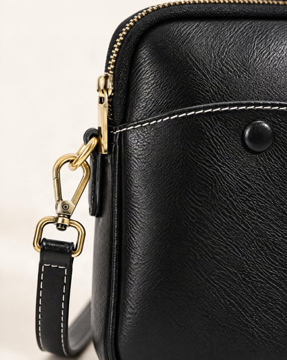 Cowhide Leather Micro Crossbody Bag with Adjustable Strap hardware and smooth cowhide detail, close up