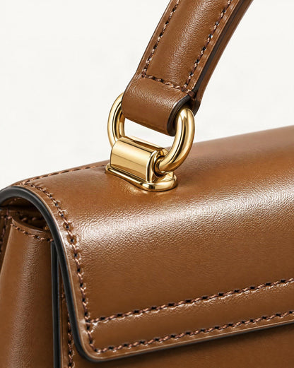 Cowhide Leather Baguette Crossbody Shoulder Top Handle hardware and cowhide detail, close up
