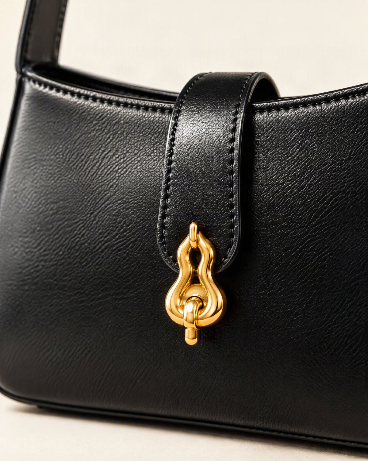 Cowhide Leather Small Shoulder Bag with Gourd Lock Clasp hardware and cowhide detail, close up