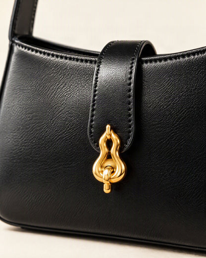 Cowhide Leather Small Shoulder Bag with Gourd Lock Clasp hardware and cowhide detail, close up