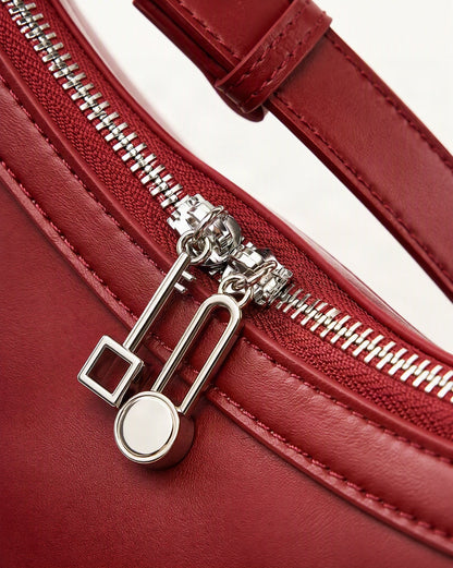 Cowhide Leather Crescent Shoulder Bag hardware and smooth cowhide detail, close up