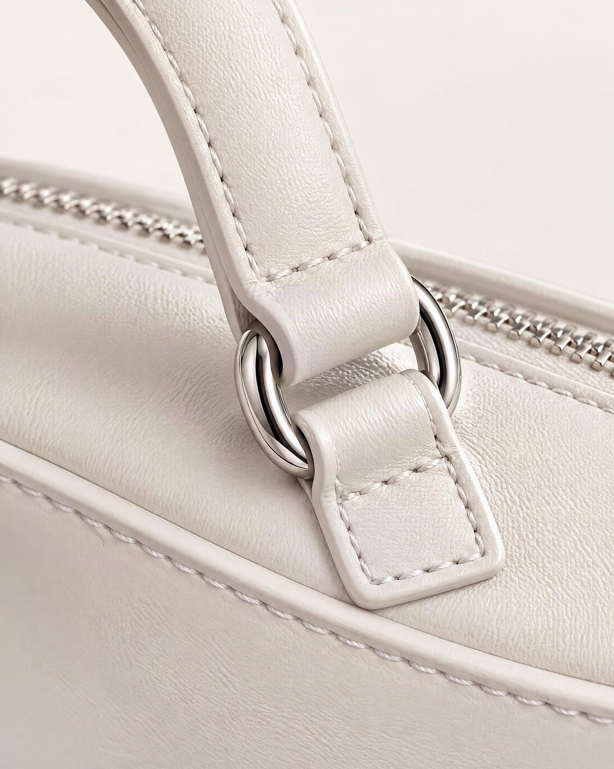 Cowhide Crescent Moon Bag hardware and cowhide detail, close up