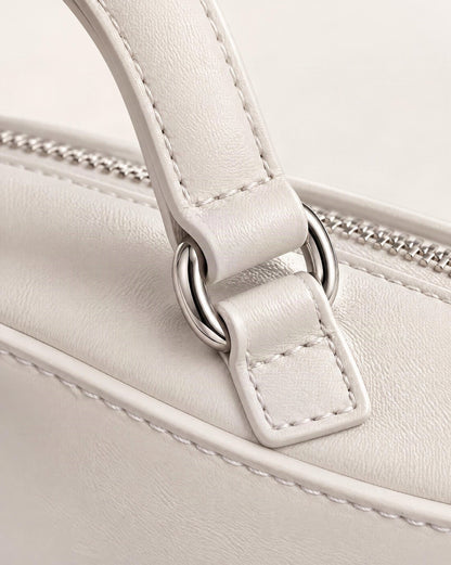 Cowhide Crescent Moon Bag hardware and cowhide detail, close up