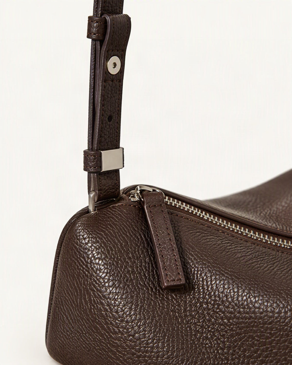 Cowhide Leather Small Barrel Crossbody Bag hardware and cowhide detail, close up