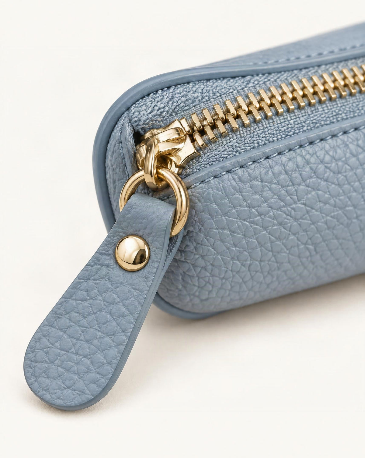 Top-Grain Cowhide Mini Zip Pouch with Keyring Clip hardware and pebbled cowhide detail, close up