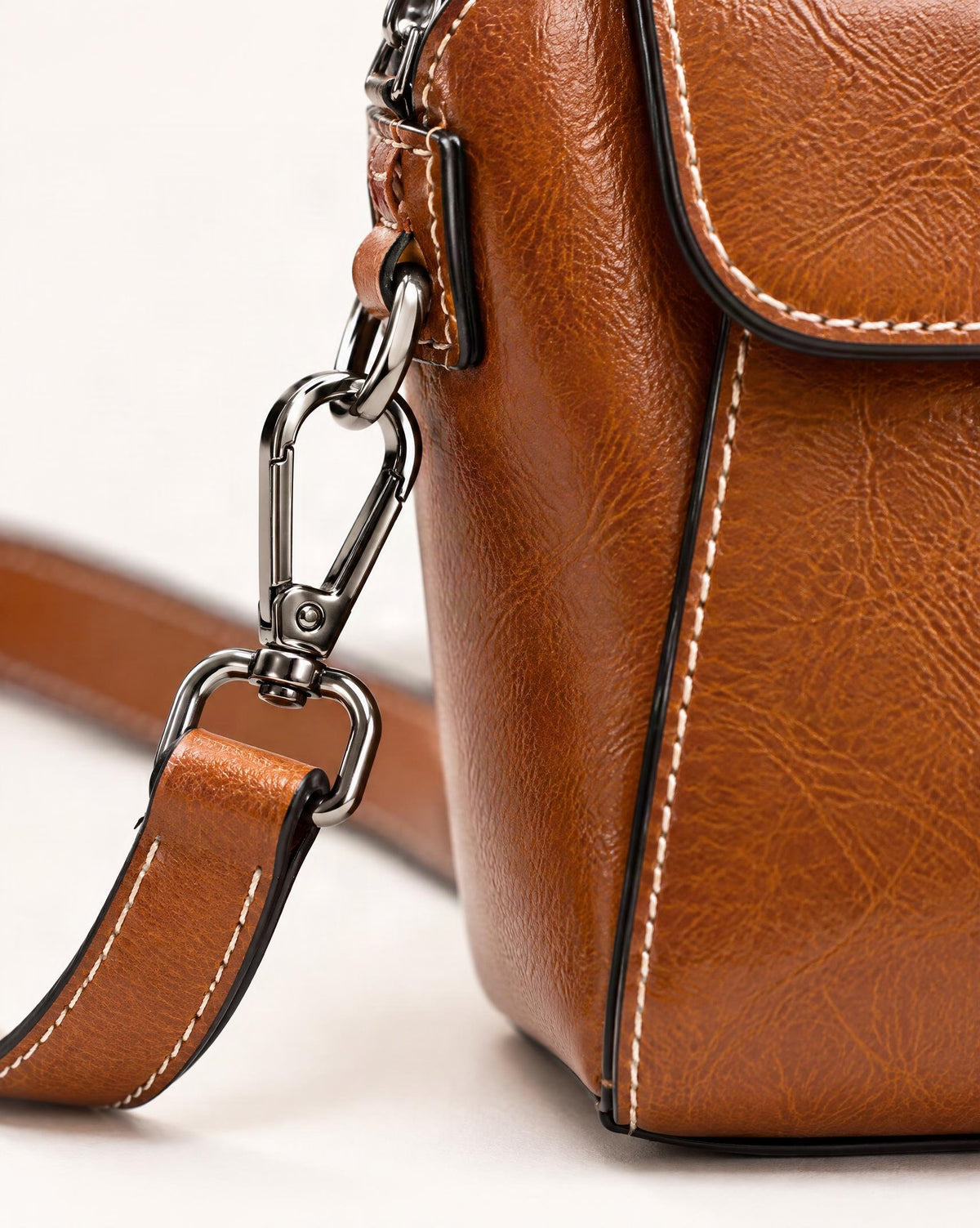 Cowhide Oil-Wax Leather Small Crossbody Bag hardware and cowhide detail, close up