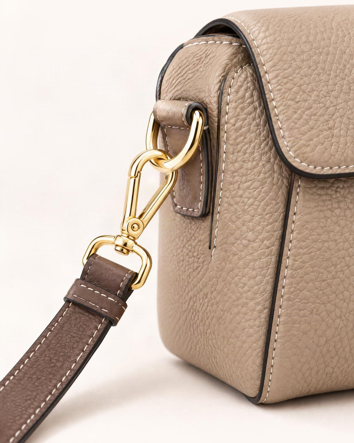 Cowhide Small Shell Crossbody Bag hardware and pebbled cowhide detail, close up