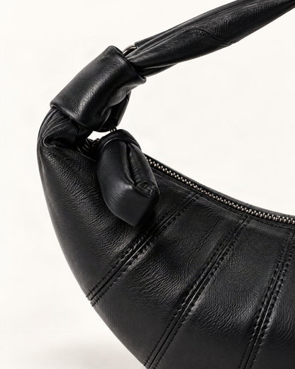 Lambskin Crescent Crossbody Bag with Knotted Strap hardware and lambskin detail, close up