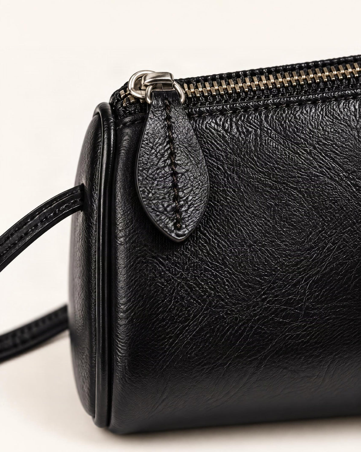 Top-Grain Cowhide Mini Barrel Crossbody Bag hardware and cowhide detail, close up