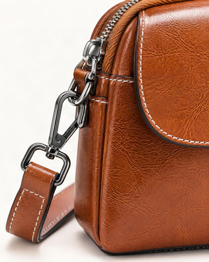 Cowhide Mini Crossbody Bag with Snap Flap, Oil-Waxed Leather hardware and cowhide detail, close up