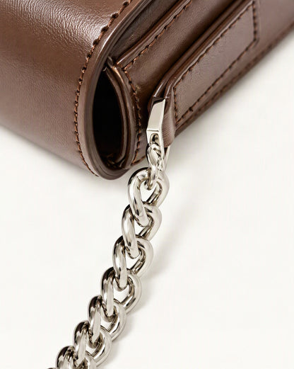 Cowhide Leather Baguette Saddle Shoulder Bag hardware and smooth cowhide detail, close up