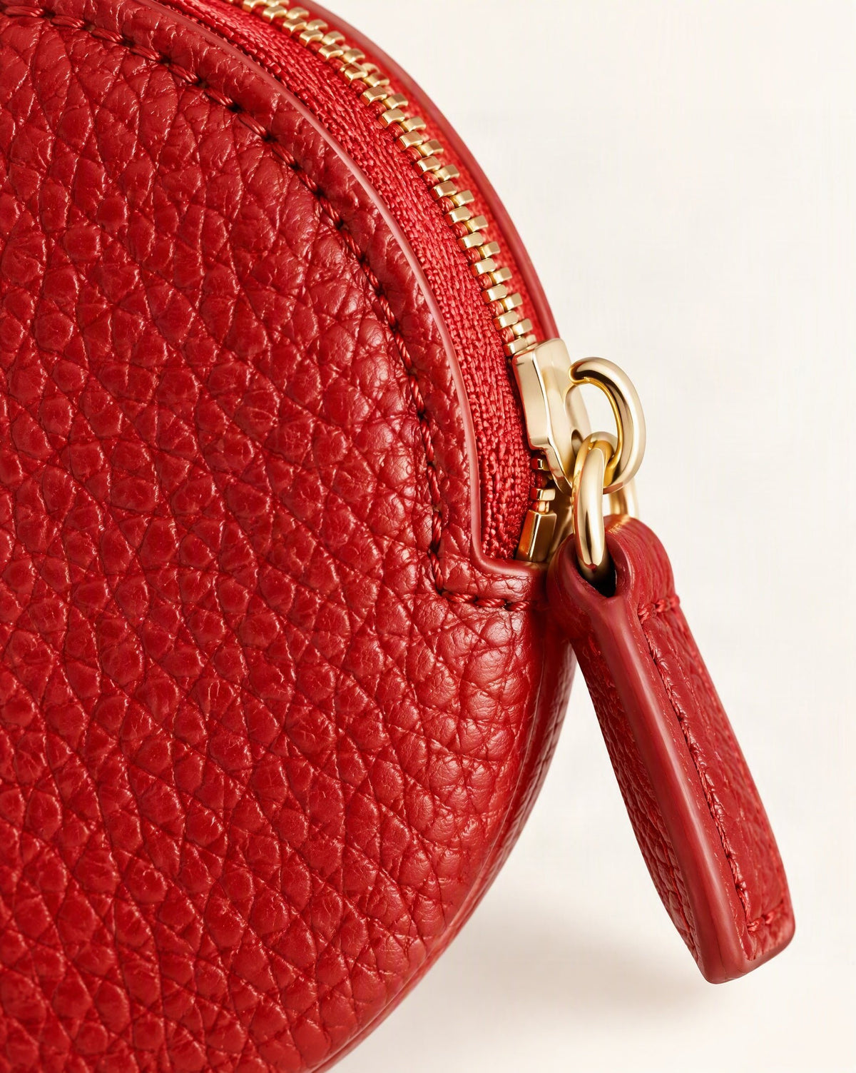 Cowhide Leather Mini Round Zip Pouch hardware and cowhide detail, close up