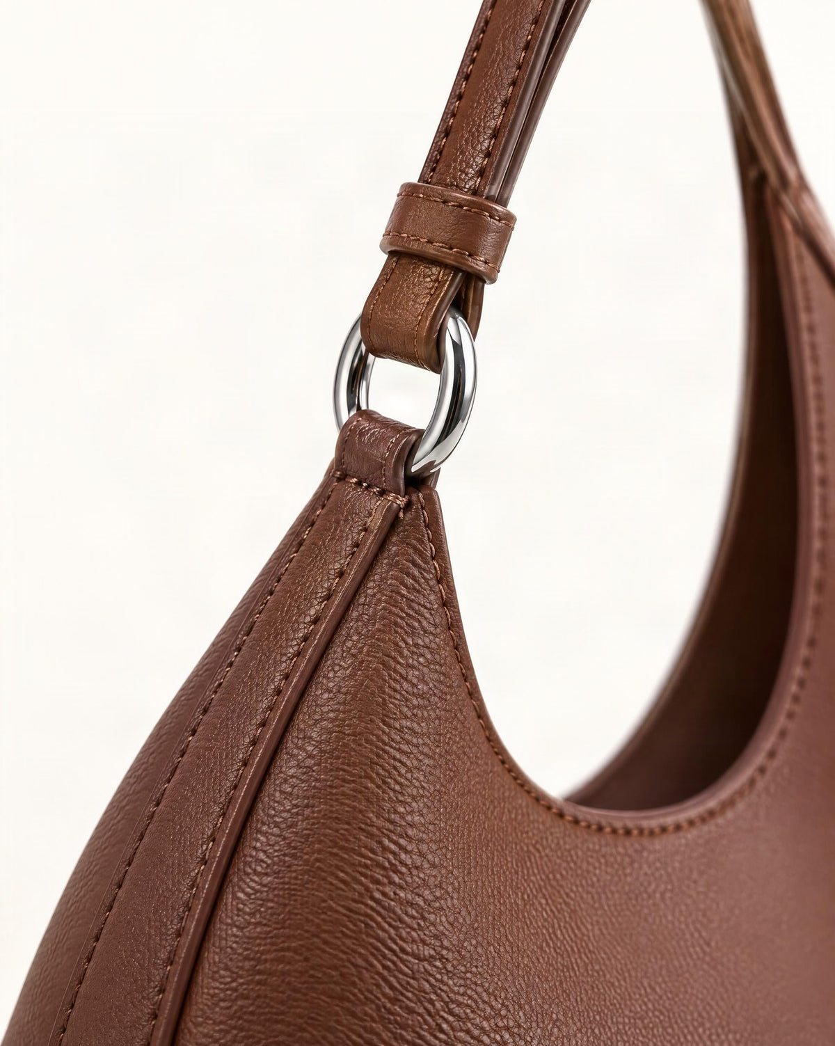 Cowhide Leather Crescent Hobo Bag hardware and cowhide detail, close up
