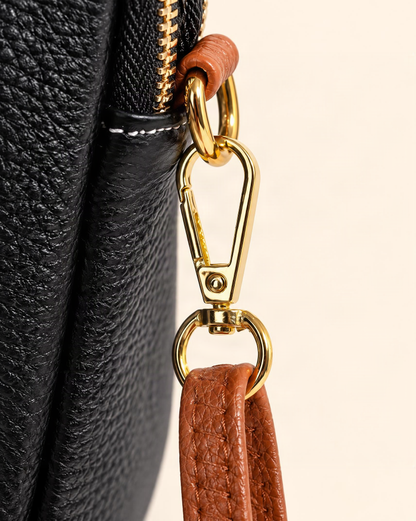 Cowhide Micro Crossbody Phone Bag with Detachable Strap hardware and cowhide detail, close up