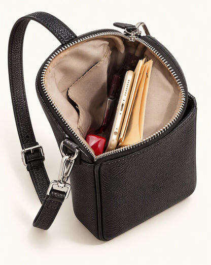 Pebbled Cowhide Micro Crossbody Bag interior, open, holding a phone, cards and a lipstick