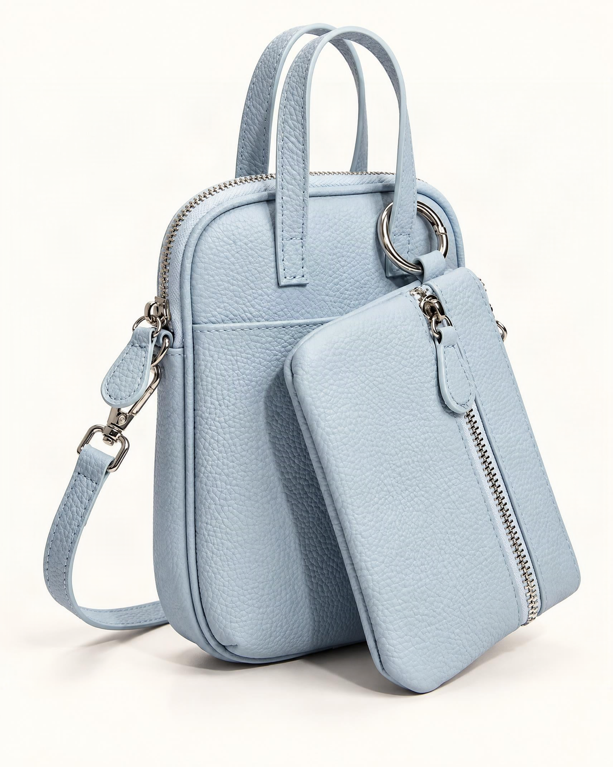 Pebbled Cowhide Micro Crossbody Bag in Alice Blue — front three-quarter view on a warm white background
