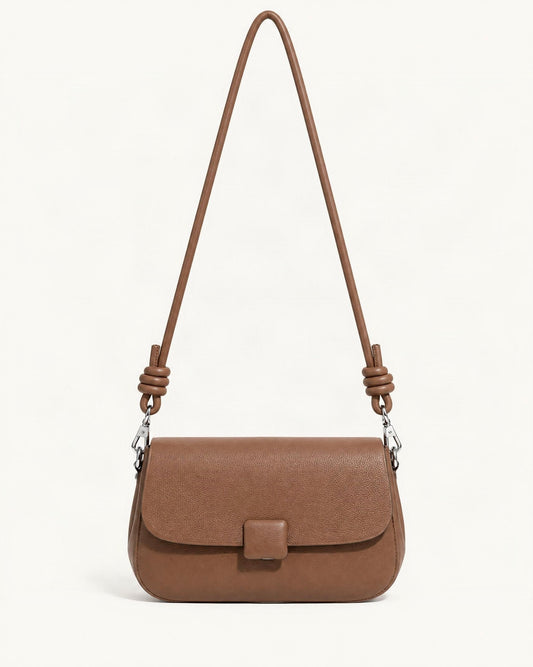 Cowhide Leather Mini Crossbody Bag — straight-on front view on a warm white background