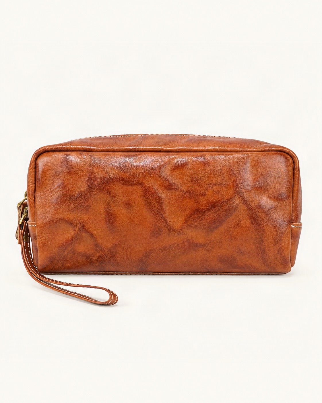 Vegetable-Tanned Leather Cosmetic Wristlet Pouch — straight-on front view on a warm white background