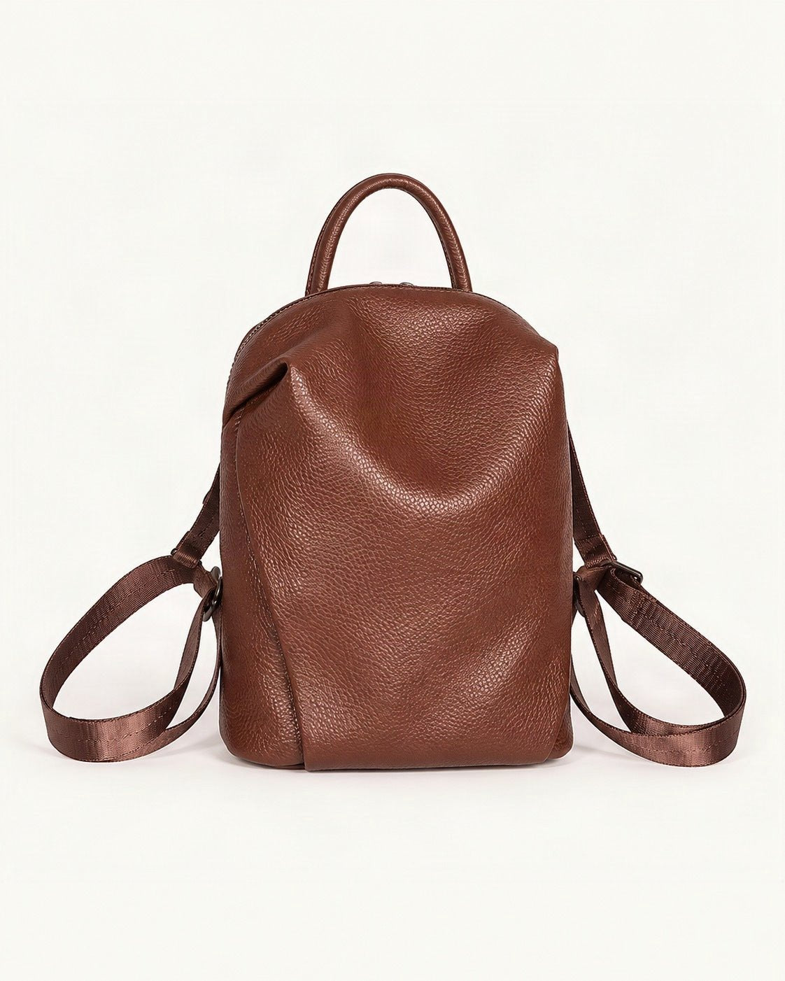 Top-Grain Cowhide Mini Backpack — straight-on front view on a warm white background