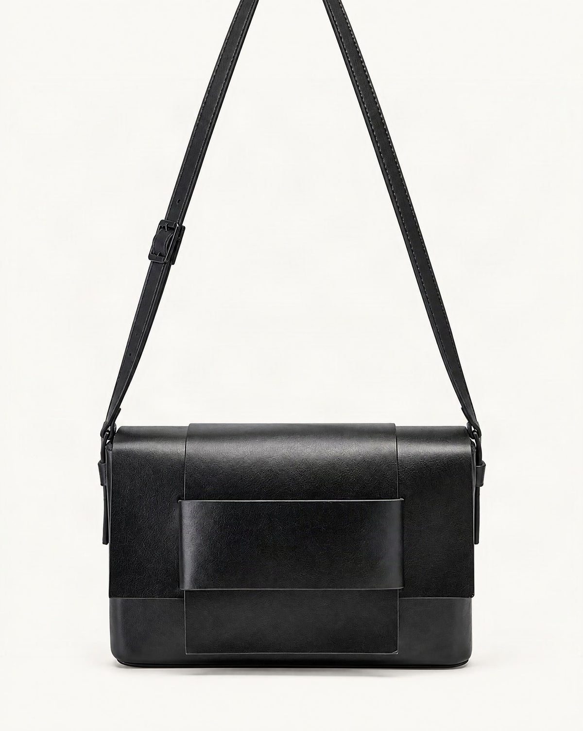 Cowhide Leather Mini Crossbody Bag with Bow Detail — straight-on front view on a warm white background