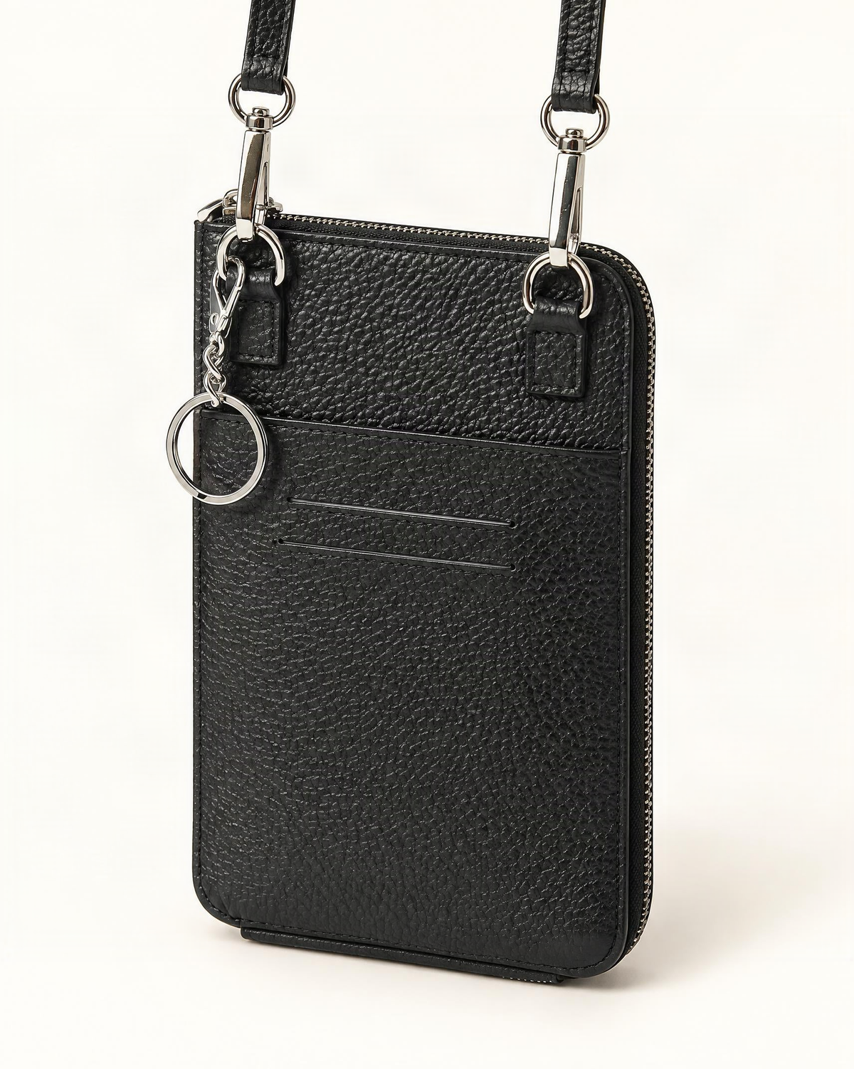 Cowhide Leather Micro Crossbody Phone Bag — front three-quarter view on a warm white background