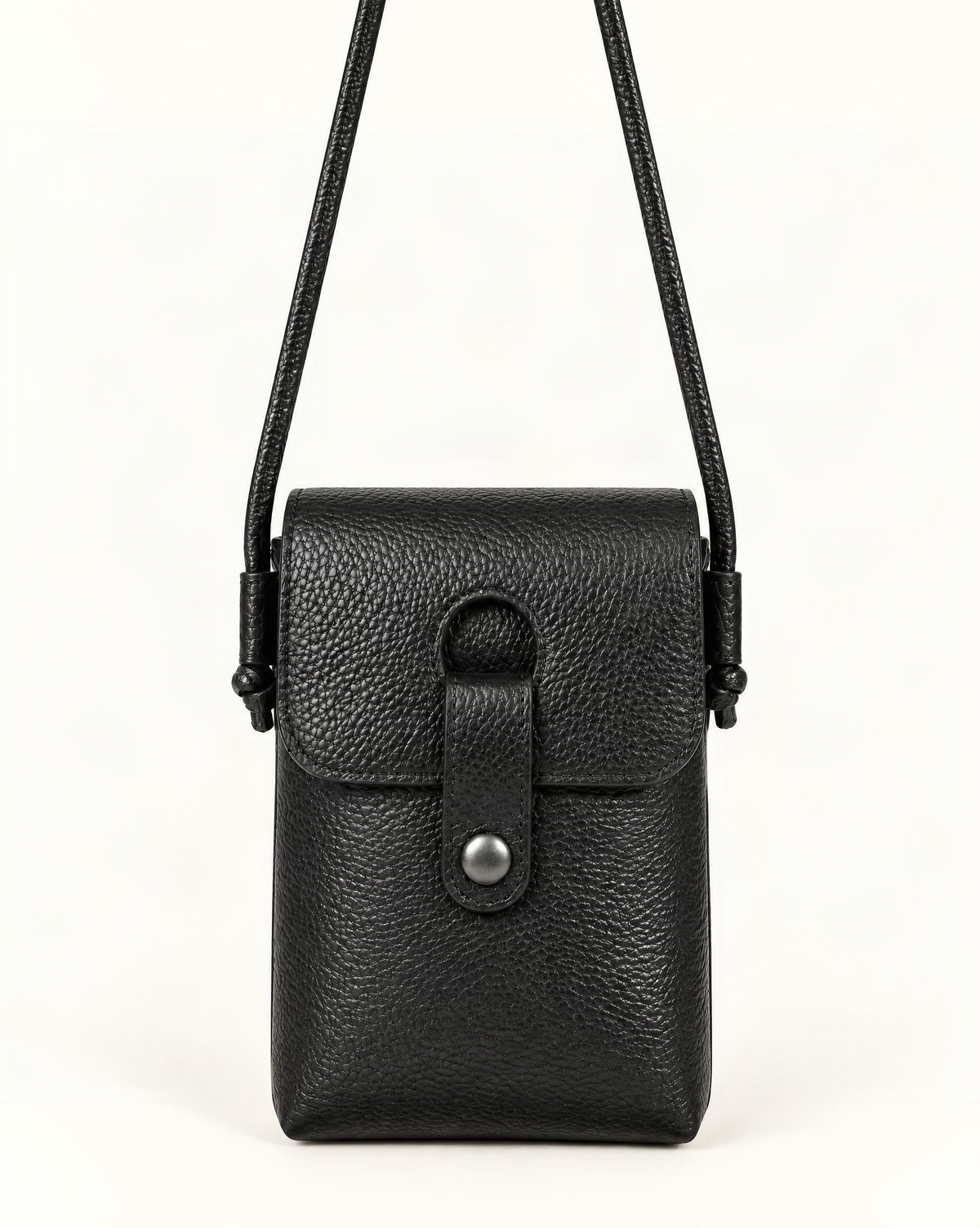 Pebbled Cowhide Micro Crossbody Phone Bag — straight-on front view on a warm white background