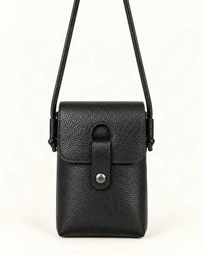 Pebbled Cowhide Micro Crossbody Phone Bag — straight-on front view on a warm white background
