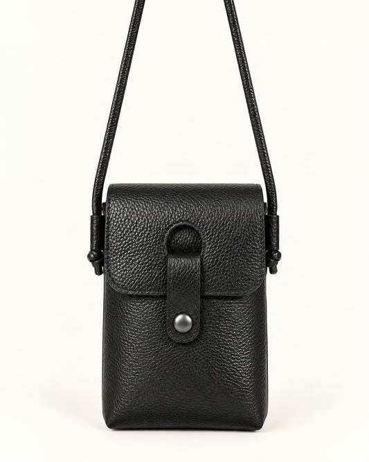 Pebbled Cowhide Micro Crossbody Phone Bag — straight-on front view on a warm white background