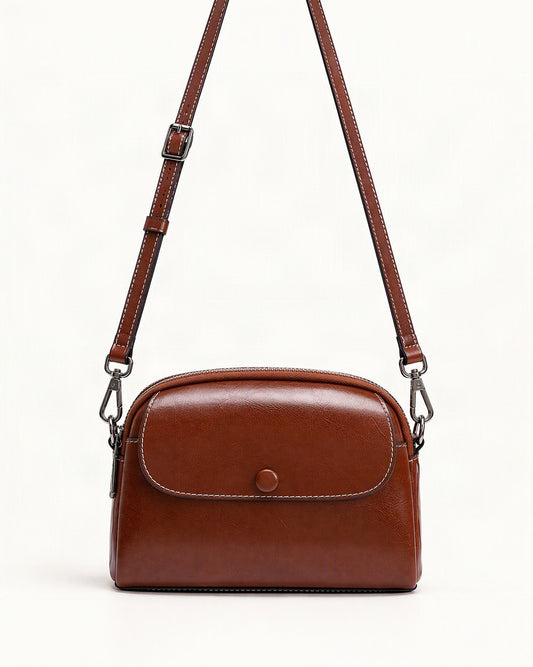 Cowhide Mini Crossbody Bag with Snap Flap, Oil-Waxed Leather — straight-on front view on a warm white background