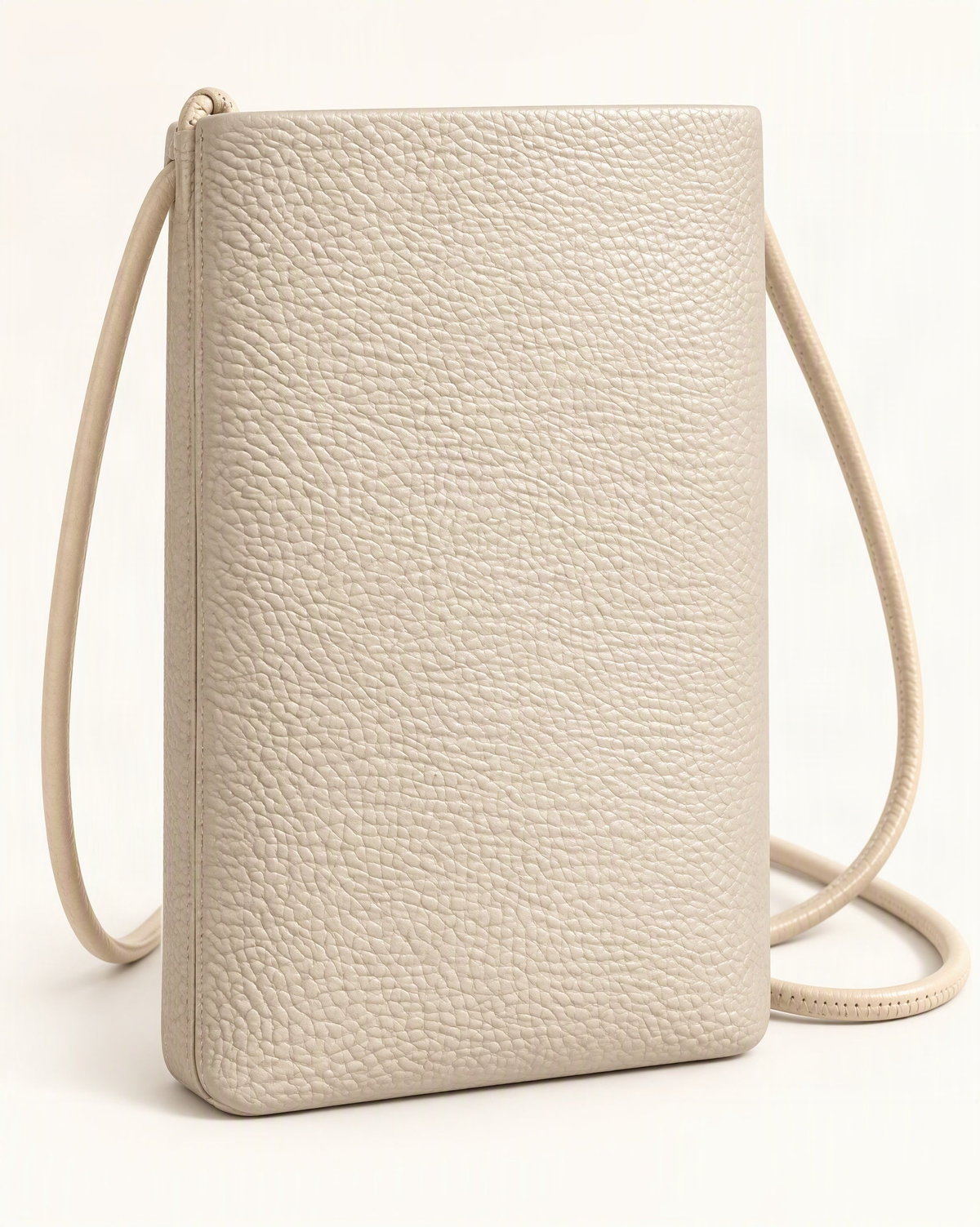 Cowhide Leather Micro Crossbody Phone Bag – Color Options — front three-quarter view on a warm white background