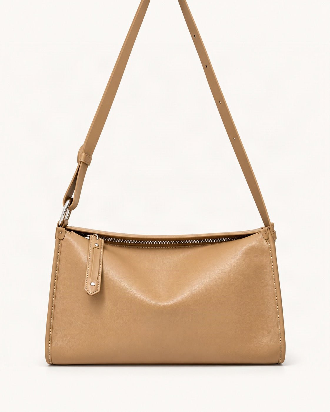 Cowhide Leather Pillow Crossbody Bag — straight-on front view on a warm white background