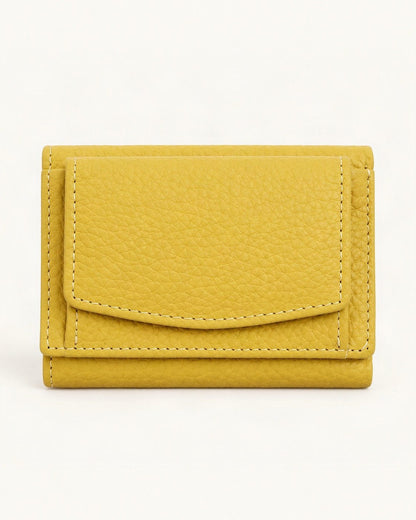 Cowhide Tri-Fold RFID-Blocking Wallet — straight-on front view on a warm white background