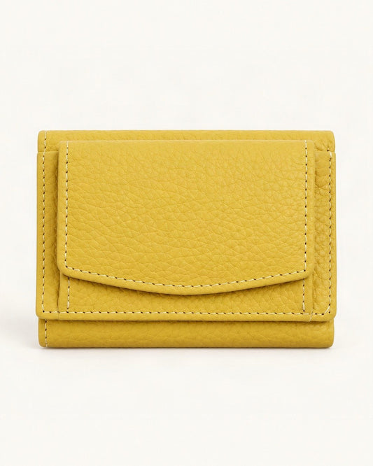 Cowhide Tri-Fold RFID-Blocking Wallet — straight-on front view on a warm white background