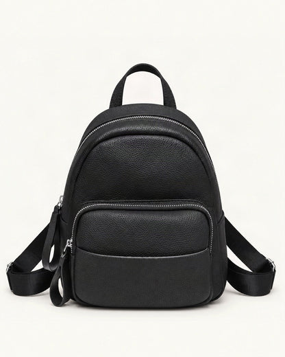 Leather Mini Backpack — straight-on front view on a warm white background