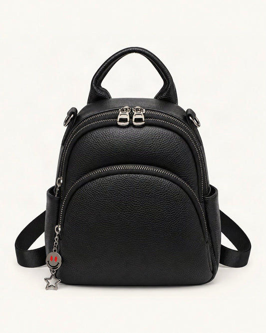 Top-Grain Cowhide Convertible Backpack — straight-on front view on a warm white background