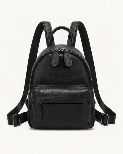 Split Leather Mini Backpack — straight-on front view on a warm white background