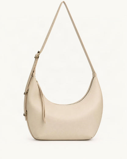 Cowhide Crescent Shoulder Bag — straight-on front view on a warm white background