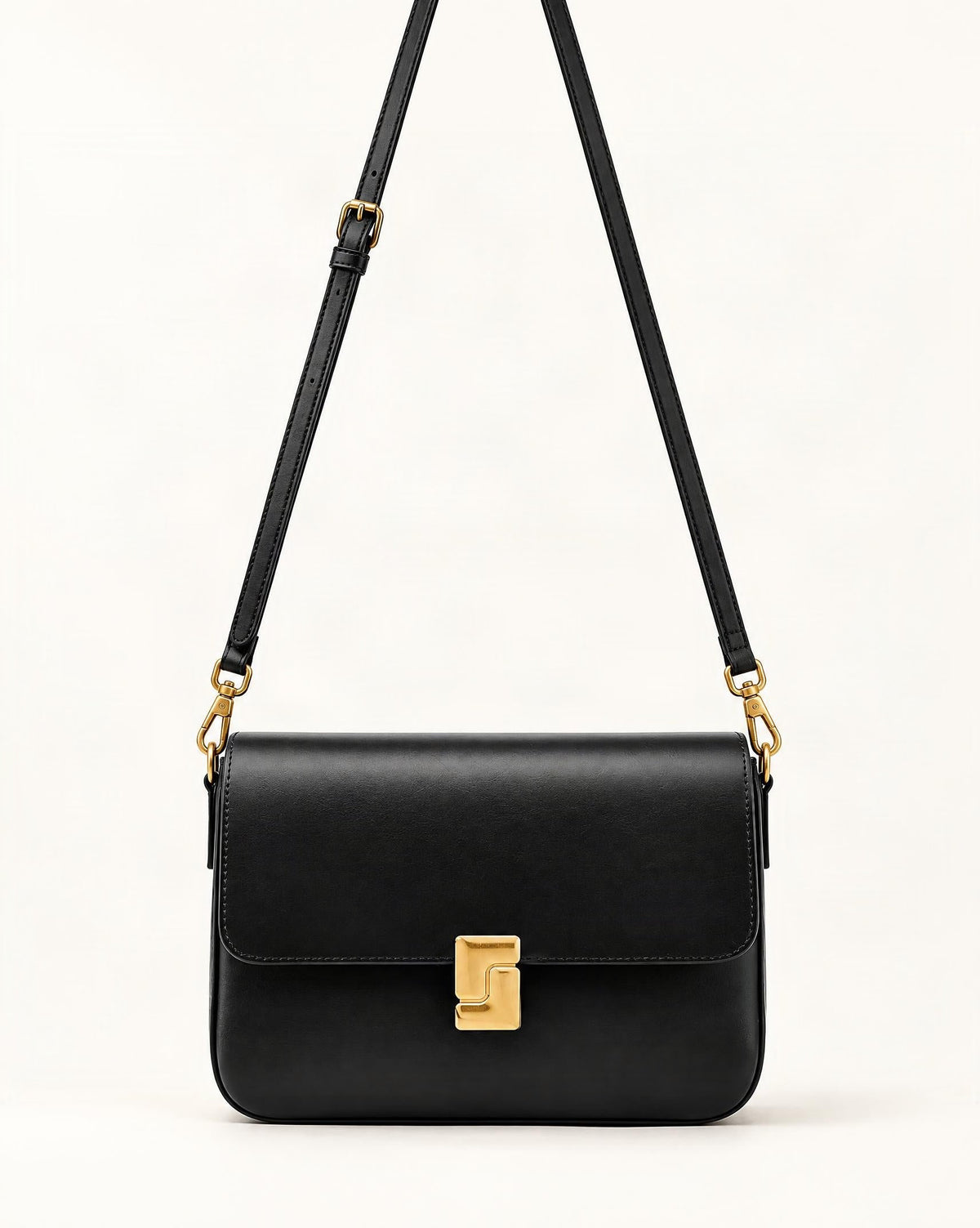 Cowhide Leather Small Crossbody Bag with Turn-Lock Closure — straight-on front view on a warm white background